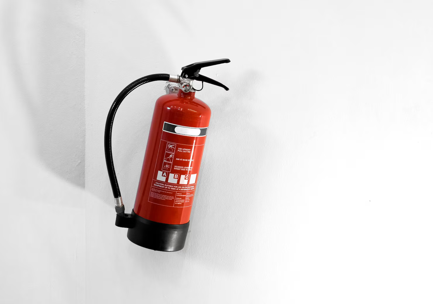 Fire extinguisher mounted in school hallway
