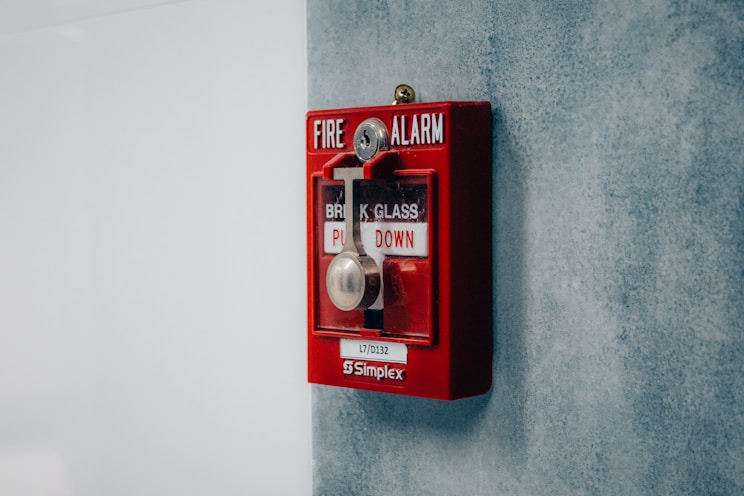 Fire alarm pull station mounted on wall