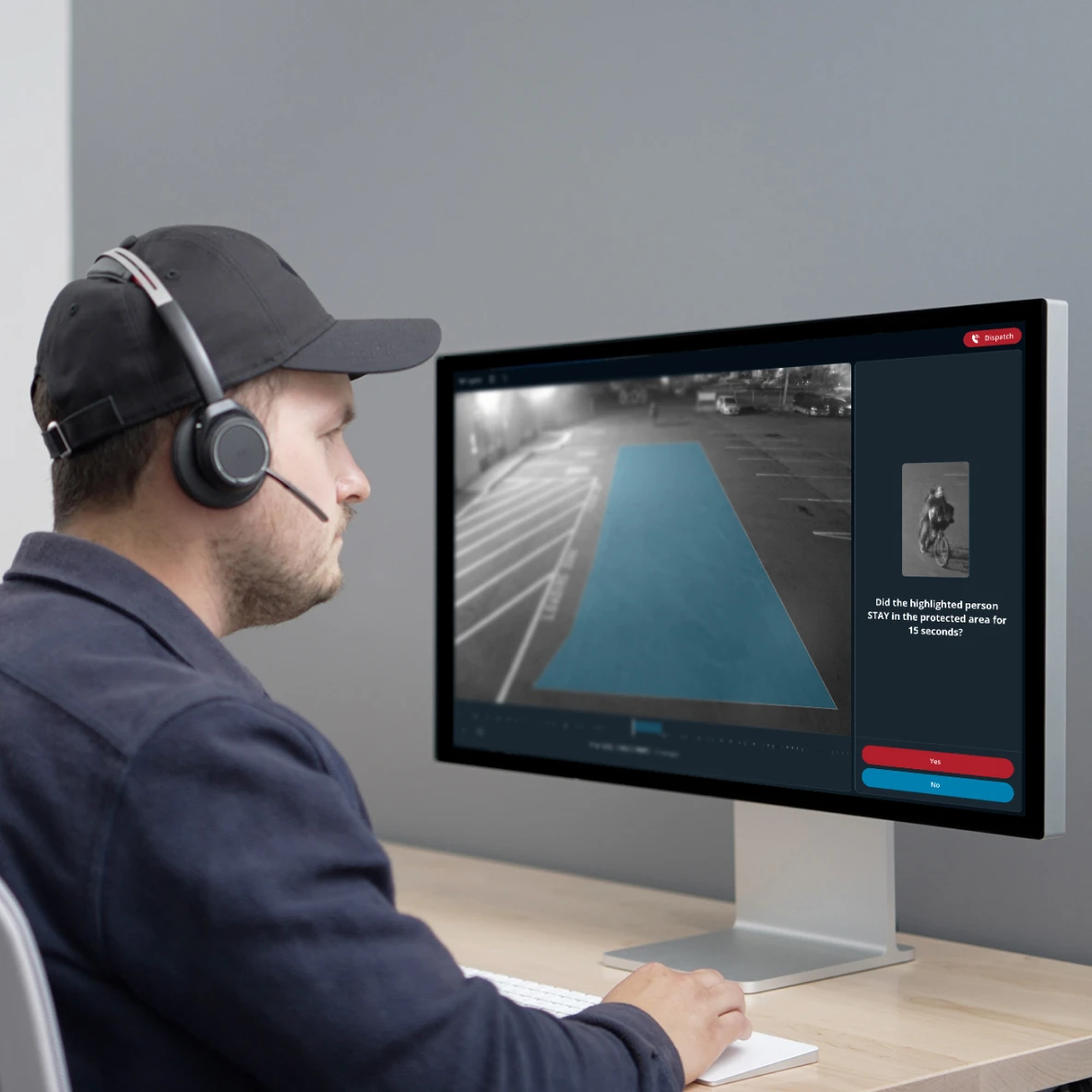 Security monitoring professional watching multiple surveillance screens