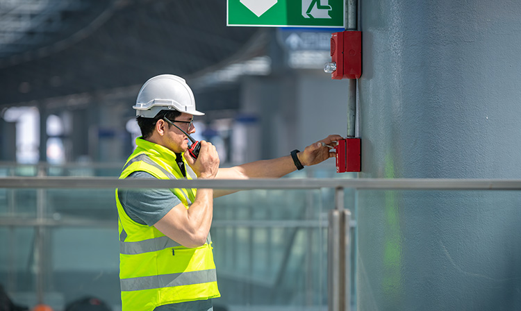 Technician working on integrated facility systems