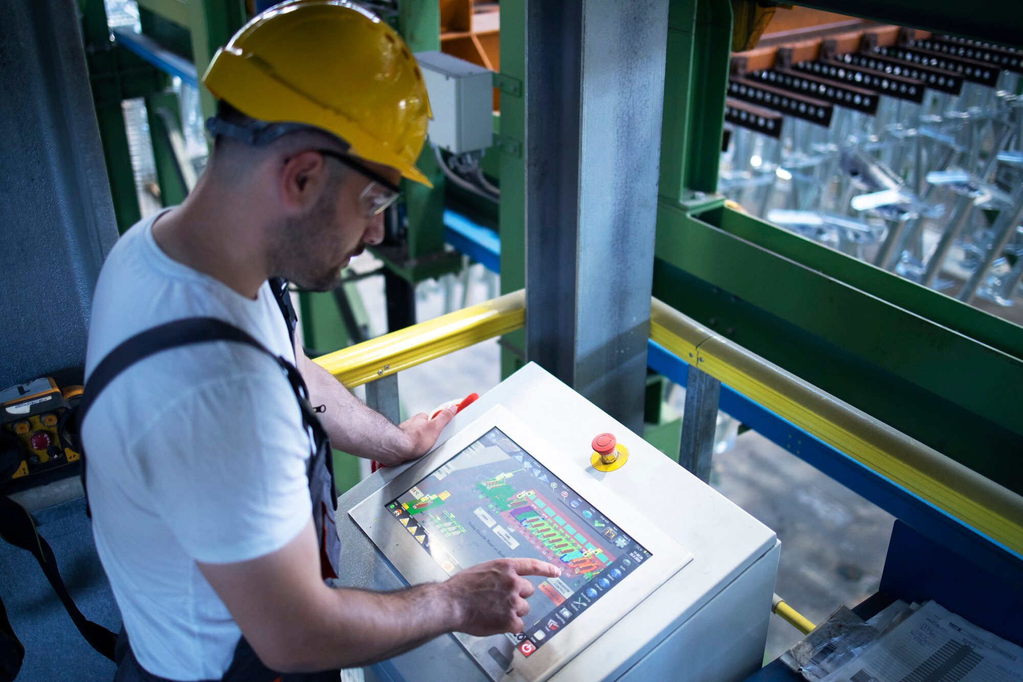 Technician inspecting fire alarm control panel